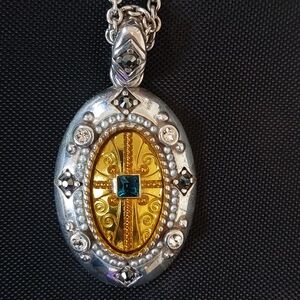Brighton silver and gold long necklace, with green rhinestone in center.